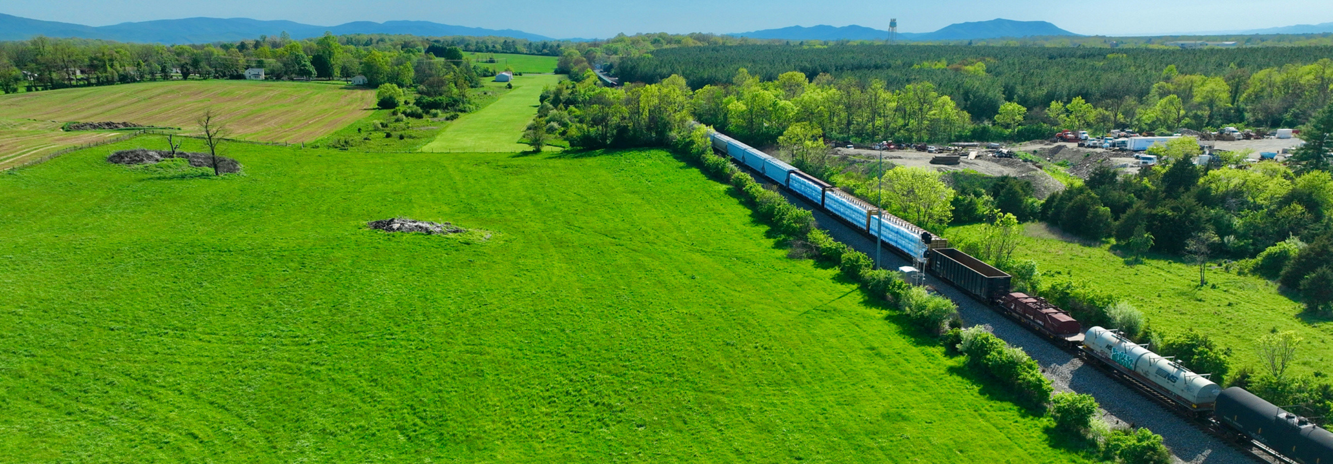 railcars moving through countryside