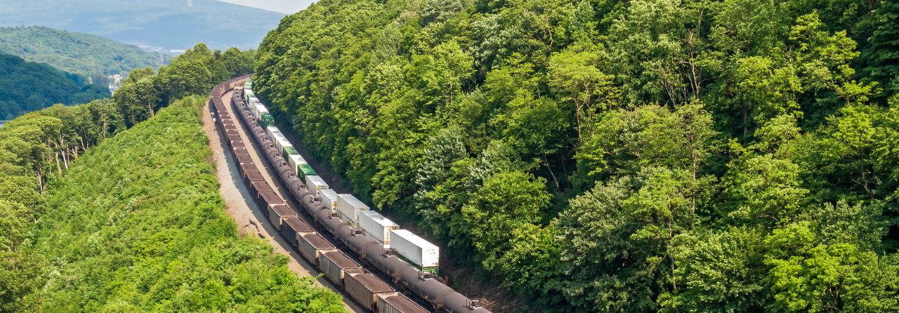 different railcars moving through mountains